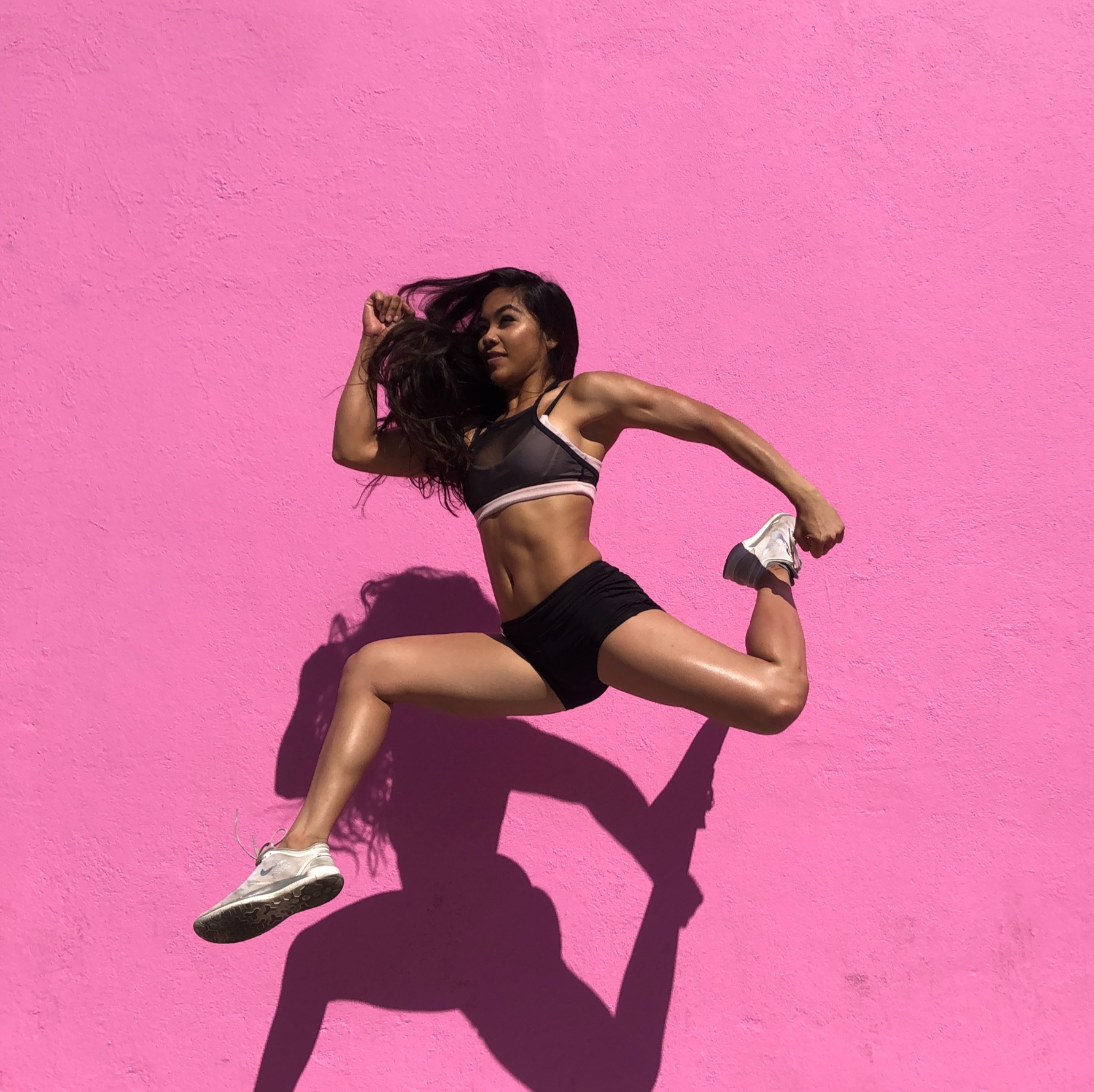 Anika mid-jump, dance-inspired athletic pose